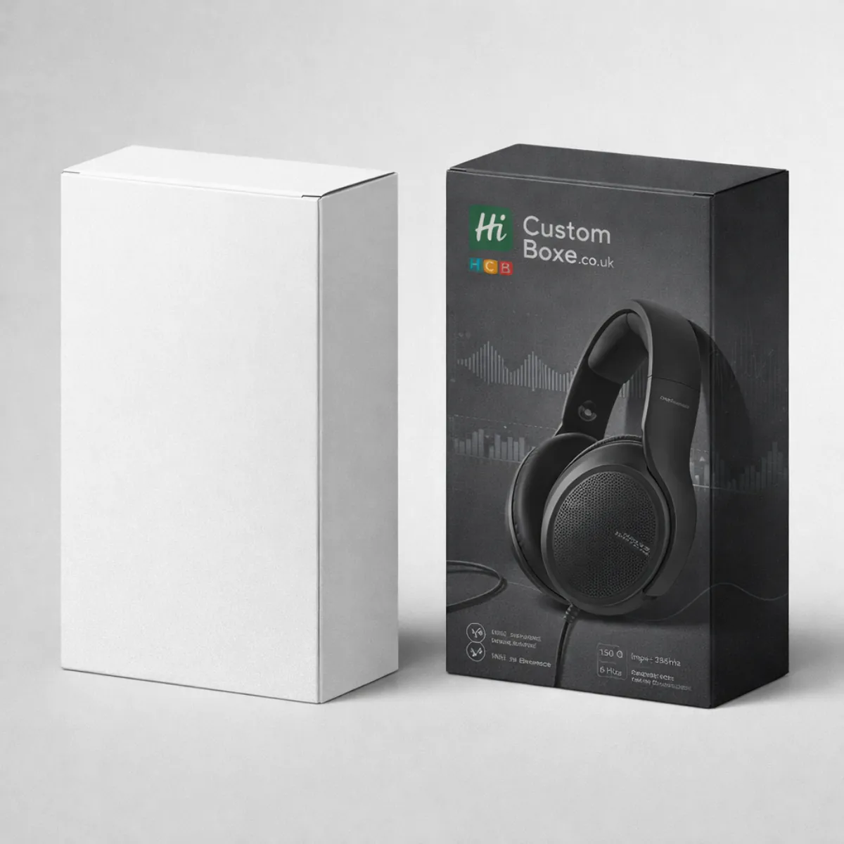A tall white rectangular box standing next to a black box featuring a professional headset image. class=